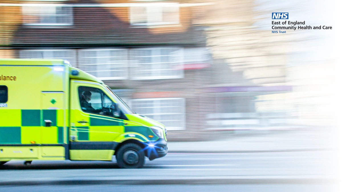 Ambulance driving quickly down a road, overlayed with the NHS East of England Community Health and Care NHS Trust logo.