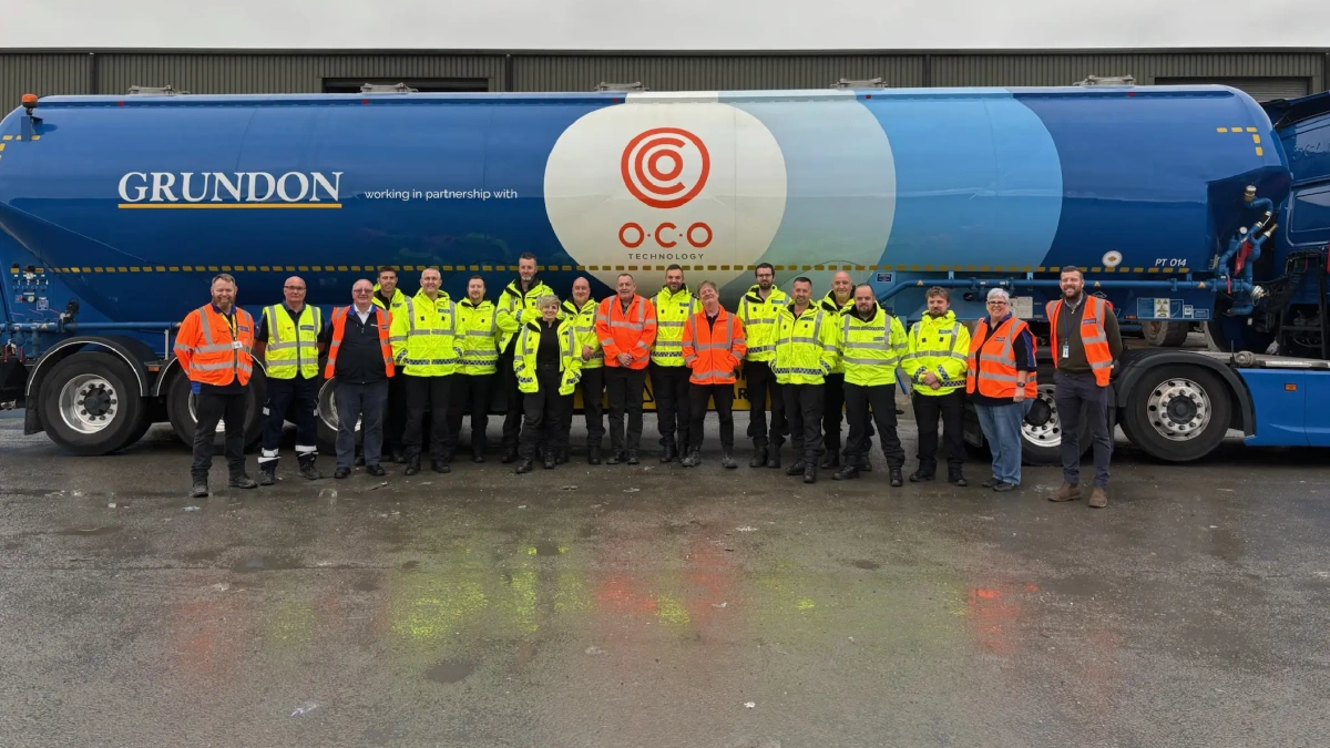 Grundon team members standing in front of Grundon branded truck.