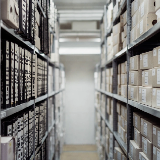 Shelves stacked with archive folders and boxes.