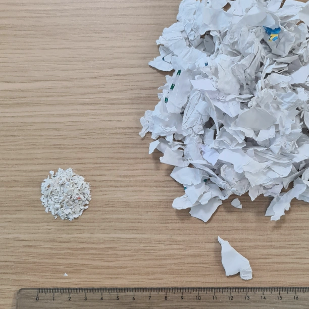 Image showing granulated paperwork next to high-security shredded paperwork.