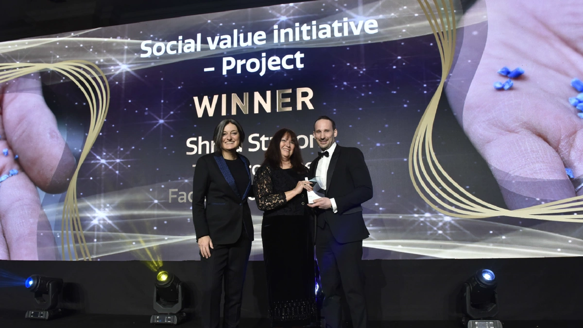 Shred Station's team receiving the Social Value Initiative Project award on stage at the National Recycling Awards.