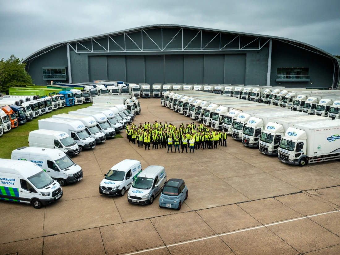 Shred Station's workforce and fleet, gathered outside of IWM Duxford in May 2023.in