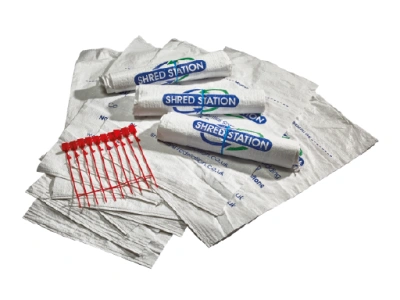 Shred Station branded confidential waste bags with red security ties.