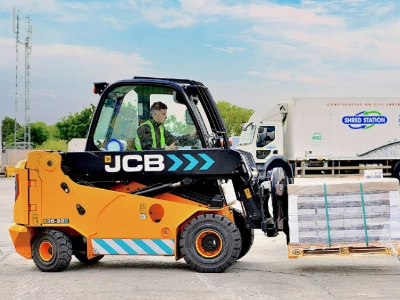 Shred Station operative driving an electric JCB forklift.