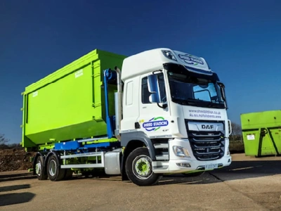 Shred Station branded skip truck.