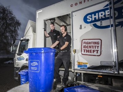 Shred Station operatives on board an on-site shredding truck.
