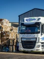 Cardboard bales outside Shred Station recycling facility.