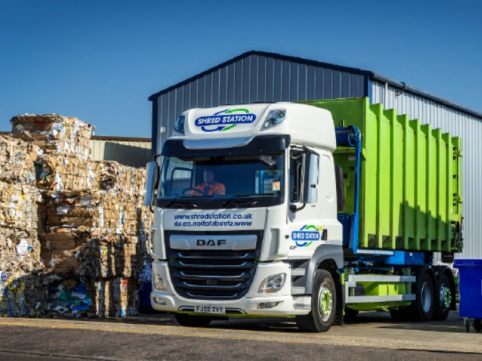 Cardboard bales outside Shred Station recycling facility.