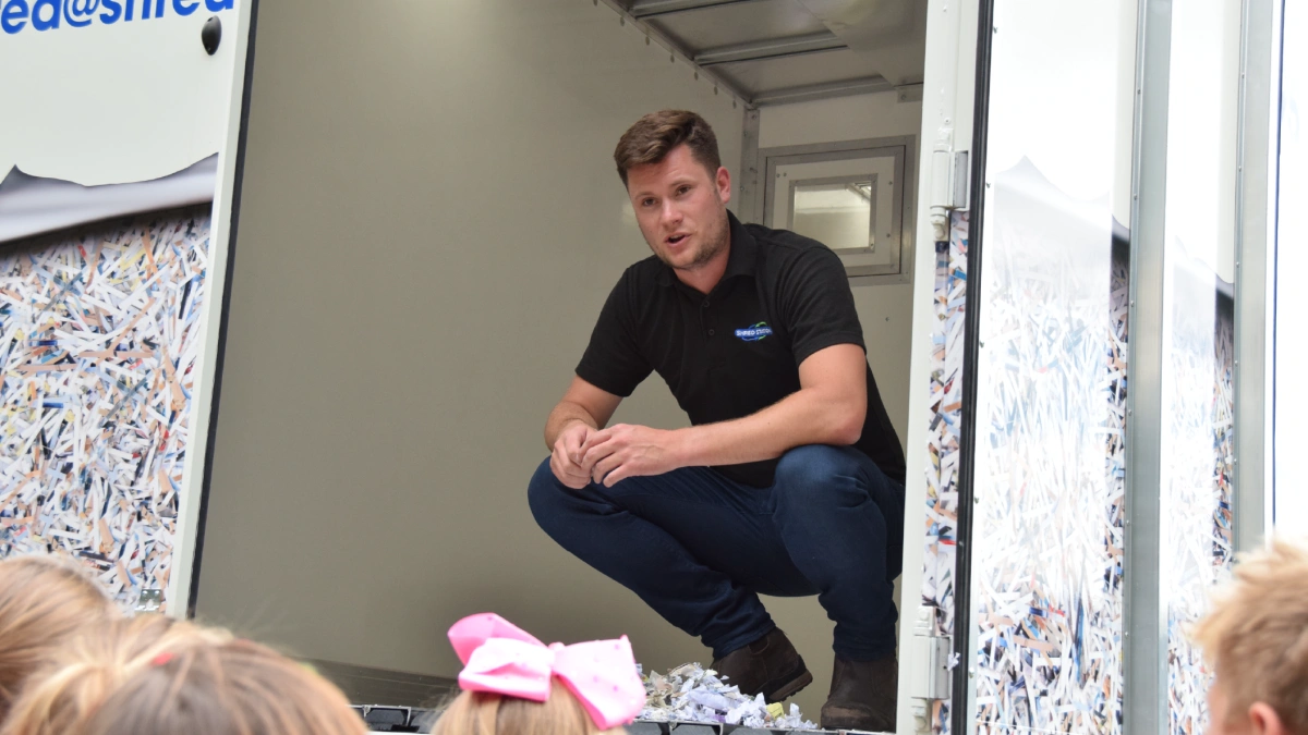 Operations Director, Oliver Grice, demonstrating on-site shredding at a local school.