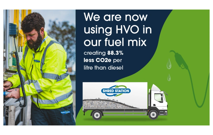 An illustration of a Shred Station operative plugging in his truck's electric side lift. Text says - 