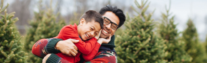 Image of father and son shopping for their Christmas tree