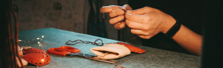 Image of person stiching a handmade Christmas stocking