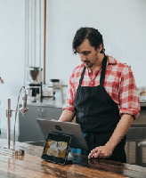Image of Man in a Café Bar, taken by Nathan Dumlao on Unsplash