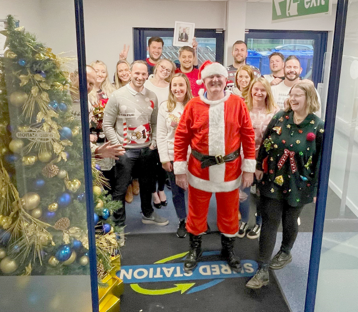 Shred Station staff celebrating Christmas Jumper Day