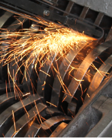 Image of industrial shredder blades being sharpened