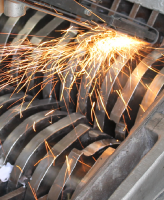 Image of industrial shredding machine being sharpened