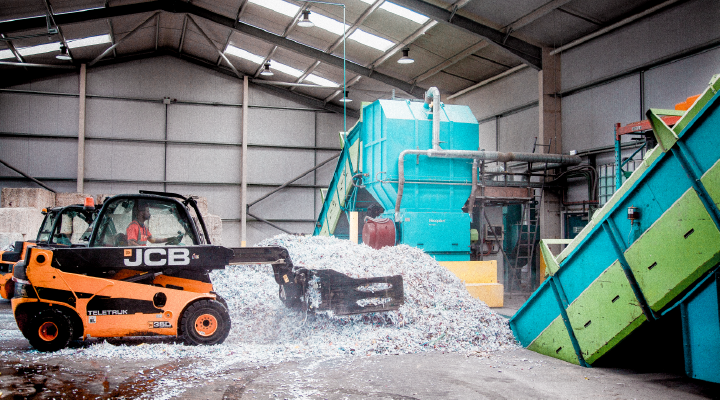 Image of shredded paper at a shredding depot.