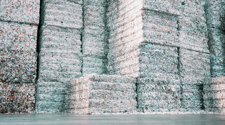 Image of large paper bales, ready for recycling.